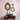 This image shows a gallery wall with two oval frames and a small square frame with vintage art prints on canvas. These decorative frames are displayed on a wall above a vintage style console table.