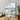 Framed artwork of a cityscape with Big Ben and the London Eye on a wall.